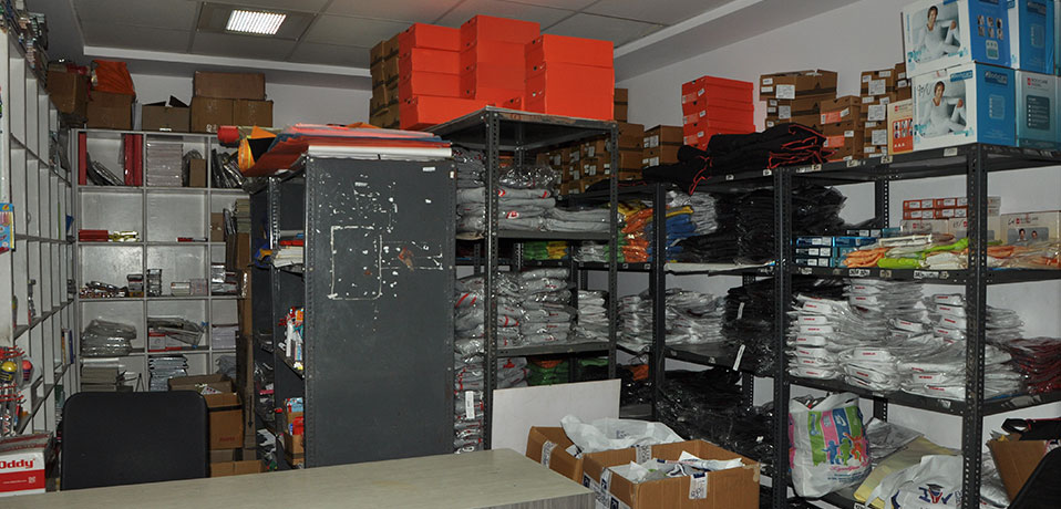 school uniform,the image shows the stock of books and uniform available in school
