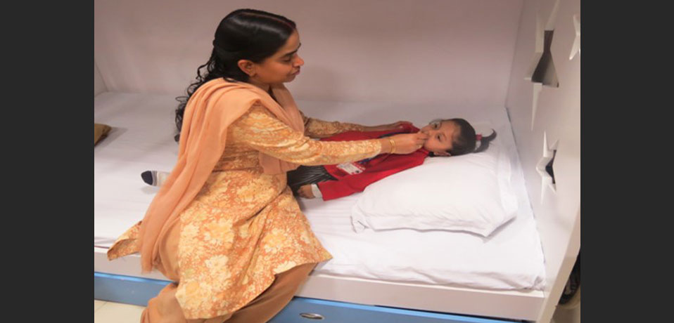 health checkup in school, the image shows a primary wing student lying on bed in medical room
