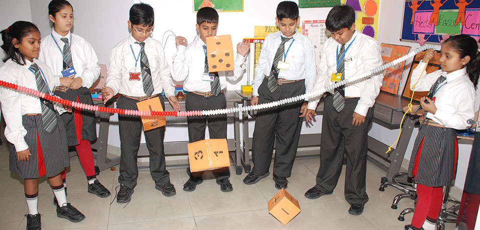 the image shows the students doing mathematics practical in lab,best secondary school in delhi
