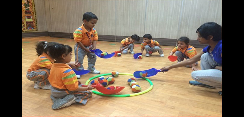 best school in sports in rohini,students of junior wing playing games in schoool campus
