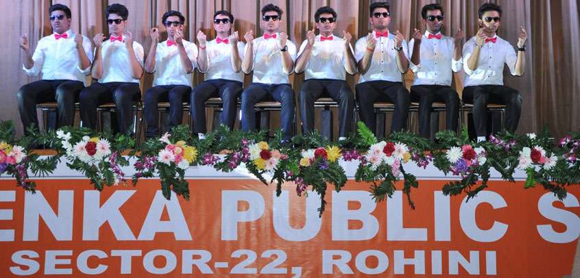 the image shows the students of senior wing performing a play in school theatre,school with theatre
