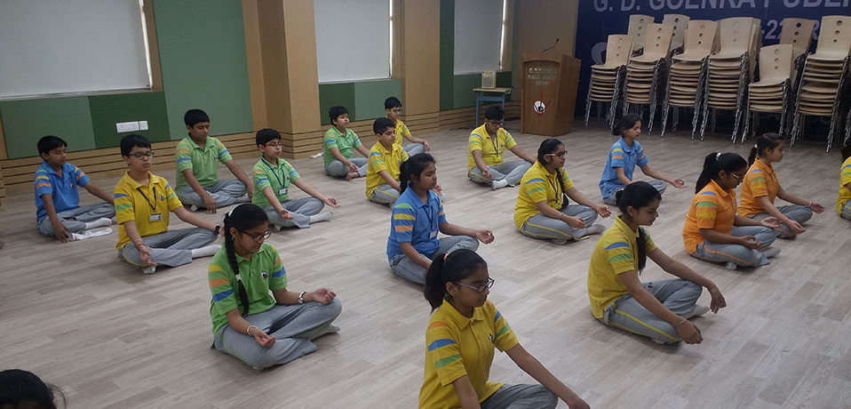 yoga room in school,image shows students are doing yoga
